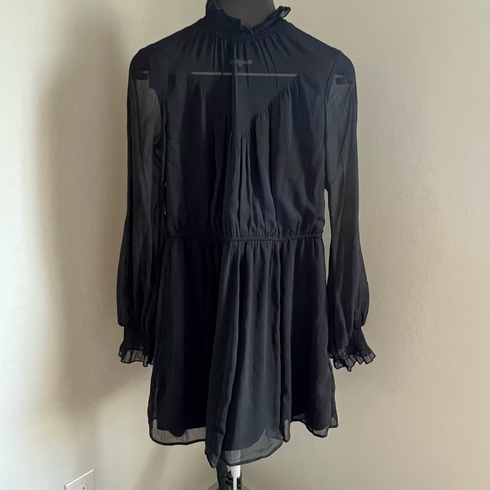 Tularosa black mini dress. Sheer at collar bone and lined throughout